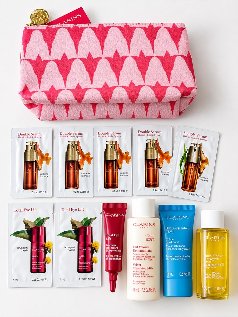Clarins Pink Patterned Cosmetic Pouch with Clarins Sample Skincare Set